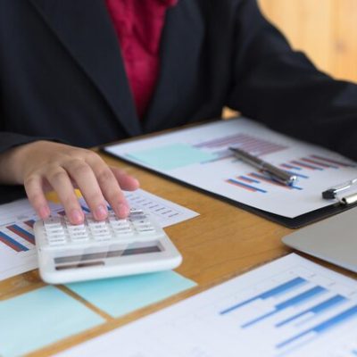 midsection-businesswoman-analyzing-graphs-desk-office_1048944-15831410